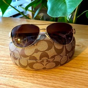 Like new Coach L012 Kristina aviator style sunglasses in color gold/olive